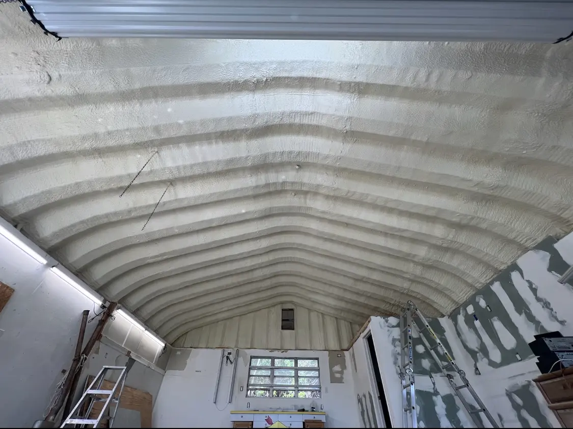 Spray polyurethane foam applied to the underside of a metal roof deck in Naperville